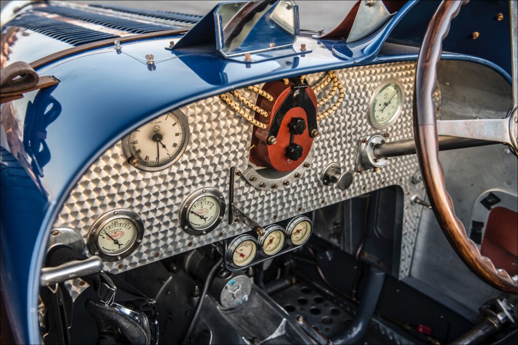 Driving moccasins are recommended, and small feet help. The definition of intimate. Gearbox is sited along your left thigh. Note tiny pedals, and the machine-turned dash panel, a Bugatti design signature. 