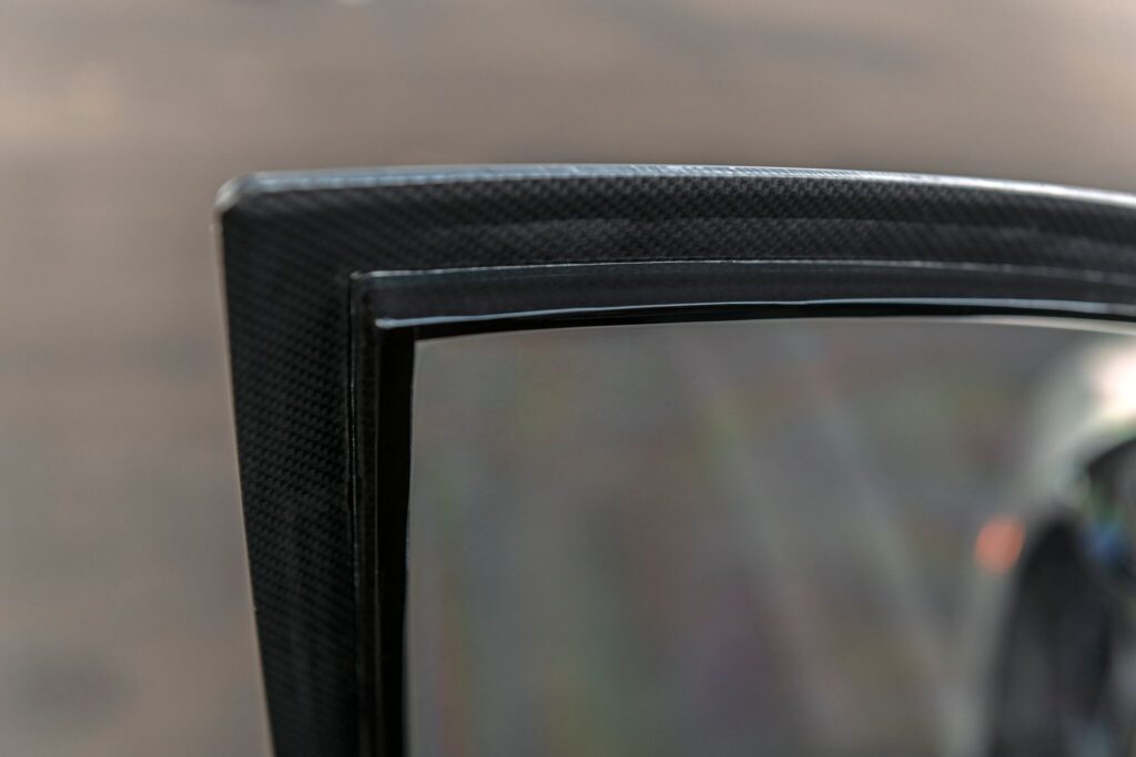 Frame shows depth of composite side window armor. 