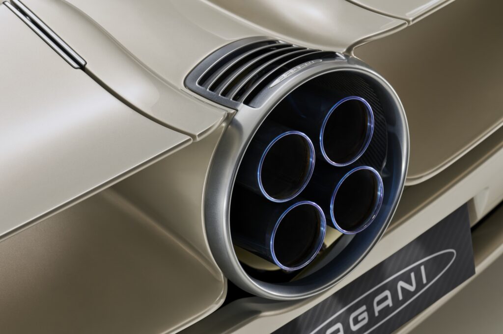 Four exhaust pipes resemble a Saturn rocket from the 1960s. In a way, this is a send-up of the 1960s race cars and supercars of the Saturn rocket era. Note the finely formed circular alloy shroud.