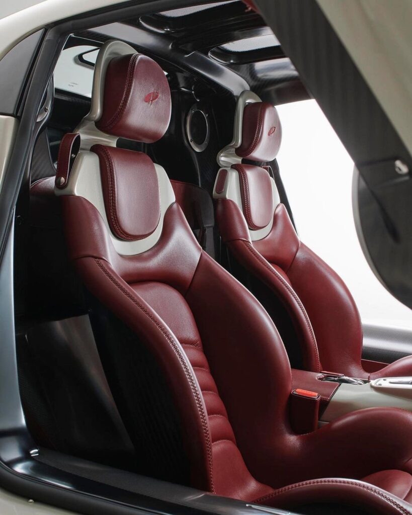  Note very high and aggressive seat bolsters for hips and ribcage. Real leather, but the lightest permutation of hide that can be found. 