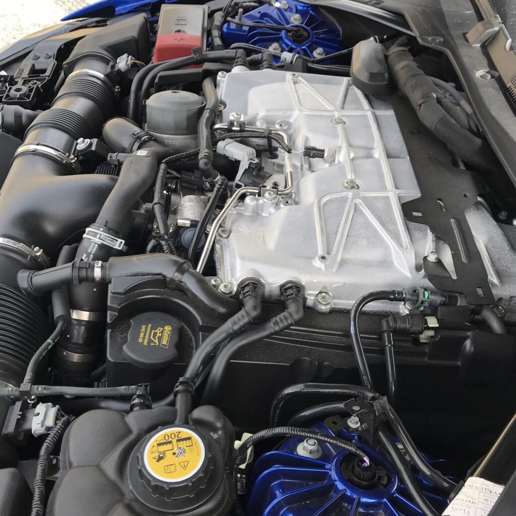 Lovely 5-liter supercharged V8 fills the engine bay and then some. Four cylinders are ahead of the suspension uprights. But the wonderfully sorted all-wheel drive system and all the related calibration of torque delivery to each wheel means Project 8 is utterly chuckable, balanced and light on its feet. Its steering is as good as any found in an AWD car. It’s so good, you might not believe that power is going to the front wheels.